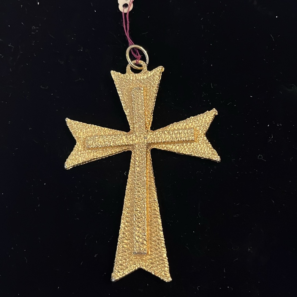 Cross on top of Cross as one piece. Gold tone. No markings. Great condition